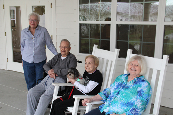A shot of The Suites at Algiers Point residents enjoying time outside. 